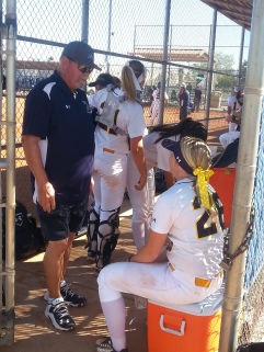 Assistant Softball Coach Mark Stoner with players