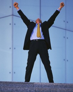 Businessman Raising Arms