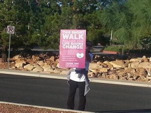 Sign reads “This short walk rallies for life saving change"