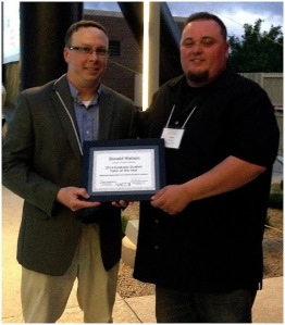 Donny Watson receiving award (Russell Carpenter on left, Watson on right)